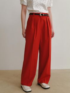 This product is a pair of Mato Pants, characterized by their wide-leg design and fluid drape, offering a combination of comfort and elegance. They are tailored to sit high on the waist, creating a sleek, elongated silhouette. The pleats at the front provide structure and a touch of classic tailoring, making them a versatile addition to both professional and casual wardrobes. - The wide-leg style allows for freedom of movement and an airy, relaxed feel, ideal for all-day wear.- A high-waisted cut with a secure closure ensures a flattering fit for a variety of body shapes.- Front pleats add a polished detail, enhancing the pants' overall sophistication.- Crafted with a lightweight fabric, these pants transition seamlessly between seasons and occasions. Red Relaxed Fit Full-length Pants, Red Wide-leg Pants With Elastic Waistband, Red Stretch Wide Leg Full-length Pants, Red Non-stretch Wide Leg Pants With Pockets, Luxury Red Ankle-length Pants, Freedom Of Movement, Casual Wardrobe, Body Shapes, Sleek