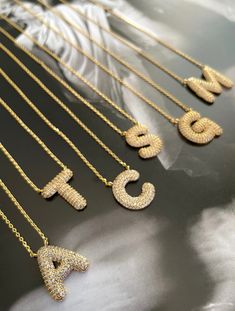 A perfect gift for any special occasion, our Chunky Sparkling Letter Necklace captures the recipient's personalities with its delicate gold filled necklace with micro pave chunky letters. It's the perfect addition to a stylish and timeless look. Chunky Letters, Carrie Necklace, Gold Filled Necklace, Letter Pendant Necklace, Heart Hoop Earrings, Casual Jewelry, Cz Necklace, Clover Necklace, Black Necklace