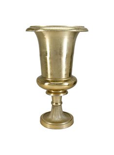 a gold colored vase sitting on top of a table