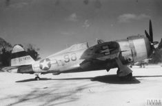 an old airplane is parked on the tarmac