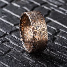 THIS RING IS CURRENTLY AVAILABLE IN STUDIO AND READY TO SHIP UPON PURCHASE!  This beautiful Mokume Gane ring is shown in a feather inspired pattern! Drawing from techniques used in making damascus patterns, Arn has been developing his own take on the style in mokume. The ring is made in our Firestorm palette, which features 14kt yellow gold, 14kt red gold, palladium and silver.  Size: 11 (please inquire if resize service is necessary) Pattern: Feather Palette: Firestorm Finish: Etched & Oxidized Profile: Flat Width: 9mm Please message us if you're interested in a custom ring quote! All of our rings are made from recycled precious metals and ethically sourced stones.  We ship internationally to most countries. Please inquire with us directly for international pricing.  For more information Damascus Patterns, Mokume Gane Ring, Mokume Gane, Jewels Rings, Pattern Ring, Feather Pattern, Custom Ring, Mens Wedding Rings, Pattern Drawing