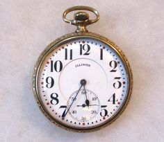 "Antique Illinois Springfield Watch Co. Open Face Pocket Watch, Gold Filled Case (No Monogram). Working.  Illinois serial number 4557188.  Production year circa 1925. Wonderful used vintage/antique condition with some normal light signs of wear/use.   Working condition.   This pocket watch appears to run just fine.   It ran for several hours before and during the time I was listing.  It was still running when I put it away.  Not tested for accuracy, no guarantee, but again appears to work just fine.   Often these pocket watches need to be serviced/cleaned for total accuracy. Watch details; Open Face. Size 16S. Model 7. Grade 606. This watch measures 49mm wide at the center. The works measures approximately 40mm in wide. 21 jewels.  Pendant movement setting, 3/4 plate. Adjusted - Yes. Doubl Timeless Stopwatch Watch As Gift, Timeless Watches With Stopwatch As Gift, Timeless Watches With Stopwatch For Gift, Timeless Gift Watches With Stopwatch, Classic Formal Watch Accessory With Stopwatch, Classic Watch Accessories With Stopwatch For Gifts, Classic Round Stopwatch Watch, Classic Round Watch With Stopwatch, Vintage Clocks