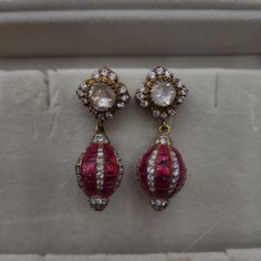 Enhance your look with our Polki and Ruby small hangings, featuring Polki stones paired with rubies. These earrings offer a perfect blend of tradition and elegance in a compact design, ideal for any outfit. Perfect for daily wear or special occasions, these hangings are a must-have for lovers of classic Indian jewelry. Material: 92.5 hallmarked silver Stones: Moissanite polkis, semi precious rubies, CZ Pin Pendant, Pendant Rings, Natural Beads, For Lovers, Compact Design, Indian Jewelry, Necklaces Bracelets, Semi Precious, Bangle Bracelets