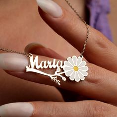 🌼 14K Gold Daisy Name Necklace - Flower Name Necklace 🌼 ✨ Welcome to a world of unparalleled elegance and personalized craftsmanship with our exquisitely designed 14K Gold Daisy Name Necklace. Each delicate petal of this masterfully crafted piece tells a story of timeless beauty and individuality, ensuring it becomes a cherished heirloom passed down through generations. 🎁 Customized to feature your chosen name, this gold minimalist necklace transcends mere jewelry--it becomes a profound expression of identity and affection. Picture the joy of wearing or gifting a piece that not only enhances your style but also carries deep personal meaning, making it an ideal gift for celebrating milestones, birthdays, or simply expressing heartfelt sentiments. 🌸 Immerse yourself in the essence of sum White Engraved Nameplate Jewelry, Customizable Gold Flower Pendant Jewelry, Personalized Flower-shaped Necklaces For Wedding, Personalized Flower Necklace For Wedding, Personalized Flower-shaped Necklace For Wedding, White Engraved Jewelry For Mom, Elegant Customized Flower Pendant Necklace, Engraved White Jewelry For Mom, Elegant Customizable Flower Necklace