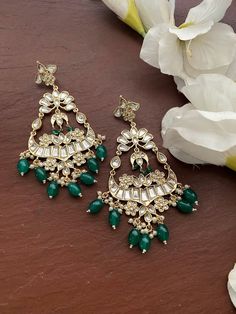 Gorgeous Earrings. Each piece is handcrafted . All the raw material used in this product is of high quality and is handcrafted with love. Height = 125 mm || Width = 65 mm Bollywood Look Indo Western Earring 100% Satisfaction Guarantee: Long Lasting Plating, High-Quality Stones. Gifting: This pair of earrings come in a beautiful gift pack , making it an ideal gift for birthday, wedding anniversary or wedding gift. Occasion: Perfect choice for any Indian occasion. Care: It is advisable that you ke Festive Gift Chandelier Earrings, Green Chandbali Chandelier Earrings For Celebration, Green Temple Jewelry Style Chandelier Earrings For Celebration, Cutdana Chandelier Earrings For Festivals, Traditional Green Chandelier Earrings For Celebration, Handmade Green Chandelier Earrings For Celebration, Green Bridal Earrings With Cutdana As Gift, Green Cutdana Bridal Earrings As Gift, Green Chandelier Earrings For Festivals And Gifts