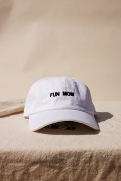 "Im not like a regular mom , I'm a fun mom." Intentionally Blank "Fun Mom" dad hat saying it all for you. cool mom One size. Adjustable back. Hand embroidered in LA. PIPE AND ROW Fun Adjustable Baseball Cap For Everyday Wear, Funny Adjustable Dad Hat Baseball Cap, White Dad Hat With Letter Print, White Baseball Cap Dad Hat With Letter Print, White Dad Hat Baseball Cap With Letter Print, Funny Baseball Cap With Curved Bill, Adjustable Curved Brim Fun Dad Hat, White Baseball Cap With Letter Print, Funny One-size Dad Hat Baseball Cap