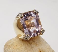 .. Title Rectangle Kunzite and Diamonds Ring in 14KT Yellow Gold Size 6.5 US Designer Unbranded Material Yellow Gold                      14 KT Stamped Style Vintage Gemstone Details   All measurements are approximate and may vary slightly from the listed dimensions. Kunzite 29.43 CT estimated 18.88 x 14.76 x 12.30   64 Stones Diamonds Single cut 0.64 Approx   Clarity G-H  Color SI3 to I1         Estimated Measurements Length/Width/Depth   Size 6.25 US Estimated  Total Weight  Dwt: 16.5   Grams: Mafia Princess, Princess Luna, Diamonds Ring, Moon Flower, Victorian Jewelry, Jewelry Inspo, Diamond Rings, Jewelry Inspiration, Style Vintage