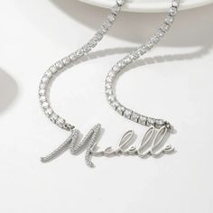 New Arrivals Luxury Silver Initial Pendant Name Necklace, Modern Cubic Zirconia Necklace As Gift, Modern Cubic Zirconia Necklace For Gifts, Elegant White Gold-colored Stainless Steel Necklaces, Personalized White Diamond Jewelry Gift, Elegant Personalized Diamond White Necklace, Elegant Stainless Steel Necklace For Wedding, Elegant Stainless Steel Wedding Necklaces, Elegant Metal Charm Necklaces For Wedding