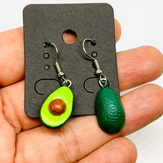 Trendy, Fresh, and Appetizing, Avocado Clay Earrings. Charming and Traditional Mexican Jewelry. The Incomparable Artistry of skilled Craftsmen. Radiant Beauty Mini Realistic Drop & Dangle Pendants for Women Girls. Summer Fashion. Mexico folk art. Old Fashion natural Clay. Hand Painted Aguacate Aretes para Mujer a Useful, Original, Cool, and Distinctive Gift that will be used and appreciated. Giftworthy! Never to be forgotten. • Eye-Catching Earrings. Never before offered!• Something New and Exci Girls Summer Fashion, Mexican Avocado, Avocado Earrings, Green Avocado, Radiant Beauty, Clay Hand, Natural Clay, Mexican Jewelry, Traditional Mexican