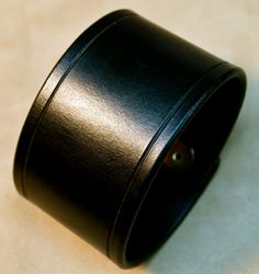 This 2 black American bridle leather cuff is perfectly sized for your wrist. The edges are scribed, beveled, slicked smooth and sealed. 2 high quality hand polished brass snaps provide the closure. Ill need your wrist size for this cuff. Instructions in the pics above! For more info on my work please visit http://freddiematara.com Thx! Freddie LIVE●LOVE♥LEATHER Classic Wide Band Cuff Bracelet, Adjustable, Classic Leather Bracelet With Waxed Finish, Classic Leather Cuff Bracelet, Leather Cuff Bracelet For Formal Occasions, Classic Black Leather Bracelet For Formal Occasions, Formal Leather Cuff Bracelet, Elegant Black Leather Cuff Bracelet, Classic Leather Bracelet With Black Band, Black Leather Cuff Bracelet For Formal Occasions