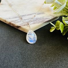 * Elevate your style with our exquisite Moonstone Pendant Necklace.  Handmade with sterling silver or 14k gold filled, this necklace features a stunning teardrop moonstone that radiates elegance and charm.  Perfect for weddings or as a birthday gift, this necklace is adorned with the June birthstone, symbolizing love and new beginnings. With its timeless design and high-quality materials, this necklace is a must-have addition to any jewelry collection. * Gemstone: AAA+ highest quality faceted Ra Silver Teardrop Gemstone Birthstone Necklace, Teardrop Necklace With Moon Charm As Gift, Teardrop Moon Charm Necklace As Gift, Teardrop Moon Charm Necklace For Gift, Spiritual Moonstone Teardrop Pendant Jewelry, Minimalist Teardrop Birthstone Crystal Necklace, Spiritual Teardrop Moonstone Jewelry, Silver Teardrop Birthstone Necklace, Sterling Silver Teardrop Necklace With Moon Charm