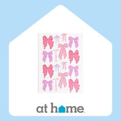 a house with pink bows on it and the words at home written in blue letters