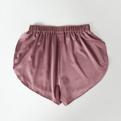 Great as bridesmaid gifts or everyday intimates, these breezy pure mulberry silk shorts are perfect for a luxurious beach look or for elevating your loungewear collection. Pair with a billowy blouse for instant chic meets laidback style or with a matching camisole for a cohesive look. Showcasing petal side hems with an elasticized back for all-day comfort, the Petal short is a must for summer styling.   Designed in Toronto. 100% pure mulberry silk, grade 6A with non-toxic dyes 19 momme silk char Satin Bottoms For Summer Loungewear, Summer Satin Bottoms For Loungewear, Summer Satin Loungewear Bottoms, Feminine Satin Bottoms For Summer, Satin Bottoms For Loungewear, Satin Short Bottoms For Loungewear, Summer Satin Shorts For Loungewear, Satin Shorts For Loungewear, Satin Loungewear Bottoms Short Length