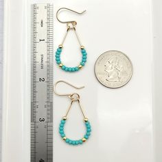 Make a statement with Lane - Gold & Teal Turquoise! These 14k Gold filled teardrop hoop earrings featuring bright teal turquoise color seed beads will guarantee you some serious style points. Perfect for a fun night out! Approximately 1.75” long Made with 14k Gold Filled wire Glass Miyuki Seed Beads Polished to a high shine Handmade in Montana Sent in a ribboned gift box with polishing cloth Turquoise Teardrop Earrings With Tiny Beads, Turquoise Beaded Teardrop Hoop Earrings, Turquoise Teardrop Nickel-free Hoop Earrings, Nickel-free Turquoise Teardrop Hoop Earrings, Nickel-free Teardrop Turquoise Hoop Earrings, Turquoise Teardrop Hoop Earrings Nickel Free, Teardrop Turquoise Nickel-free Hoop Earrings, Earrings Small Hoop, Teardrop Hoop Earrings