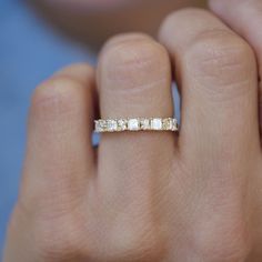 a woman's hand with a ring on it