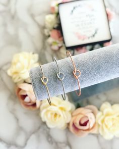 Rose gold, silver or gold knot bangles are part of our Tie the Knot Collection! This listing features our adjustable, nickel free, stainless steel, knot cuff bangle available in three finishes, Rose gold, Silver or Gold! These bangles are the perfect gift to commemorate your wedding day with your best girls by your side. You can customize these to be used a thank you gifts or a special way to ask them to be a part of your big day! I would also LOVE to personalize these for you with a To: and Fro Adjustable Rose Gold Bangle For Gift, Adjustable Rose Gold Bangle As Gift, Adjustable Rose Gold Minimalist Cuff Bracelet, Knot Bangle, Tie The Knot, By Your Side, Cuff Bangles, Tie The Knots, The Knot