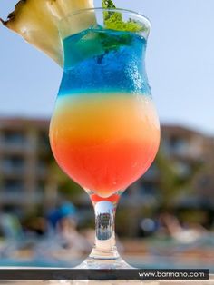 a colorful drink sitting on top of a table