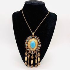 Excellent Vintage Large Etruscan Style Turquoise Glass Cabochon & Dangles Necklace. Ornate gold plated metal in a Etruscan style set with turquoise glass cabochons and dangles. In excellent vintage condition with minimal age appropriate wear. Pendant measures 5 1/8 inches long by 2 1/4 inches wide. The triple link chain measures 17 inches long with secure clasp. Beautiful!! Vintage Designer Jewelry, Dangle Necklaces, Turquoise Glass, Necklace Vintage, Vintage Designer, Designer Jewelry, Fashion Set, Vintage Necklace, Antique Jewelry