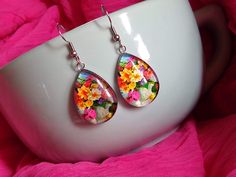 Vibrant Colorful Flowers Vintage Floral Themed Glass Earrings Artistic, bold statement earrings, a perfect gift for artists and nature lovers for any occasion. Measures 0.98 inches in length and 0.70 inches in width. Comes with First Class Free shipping. Colors may vary due to monitor and lighting differences. Broken Arrow, Flowers Vintage, Gifts For An Artist, Gift Jewelry, Earrings Vintage, Glass Earrings, Nature Lovers, Vintage Flowers, Vintage Earrings