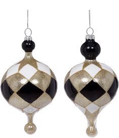 two black and white christmas ornaments hanging from the top of each ornament,