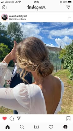 the back of a woman's head wearing a wedding dress