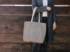 A textural design reminiscent of sea sand adds a modern, simply touch to this tote. Available in 2 sizes to add both functionality and style, these tote bags come with three handle colors to choose from. Made with spun polyester, these bags feature double-stitched seams, cotton webbing straps, and nonwoven laminate lining for high-end durability. .: Made with 100% polyester, a medium-weight fabric (6.49 oz/yd; (200 g/m) that is highly durable and perfect for everyday use.  .: 2 color handle options  .: All tote bags come with a non-woven laminate inside, cotton handle, and are available in 3 sizes (1x large storage compartment) .: NB! Size tolerance 0.75" (1.9 cm) Size:              Height, cm    Length, cm     Width, cm 13"x 13''         33.02cm         33.02cm         8.80cm 16" x 16'' Everyday Textured Tote Bag, Textured Tote Shoulder Bag For Travel, Textured Tote Bag For Everyday Use, Textured Travel Tote Shoulder Bag, Textured Bags For Daily Use, Chic Sand-colored Beach Bag For Everyday Use, Rectangular Textured Shoulder Bag For Everyday Use, Rectangular Textured Shoulder Bag For Travel, Rectangular Textured Shoulder Bag For Everyday