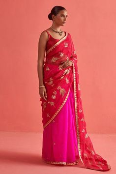 Red and pink ombre saree in organza base with dainty embellishment of paisley flora bloom highlighted with pearls, hand embroidered brass gota patti jaal and border. Paired with a sleeveless matching mashru silk padded blouse and petticoat. - Aza Fashions Party Organza Pre-draped Saree With Gota Work, Festive Pink Silk Pre-draped Saree, Pink Pre-draped Saree With Dupatta In Tissue Silk, Pink Pre-draped Saree With Gota Work, Festive Red Pre-draped Saree In Organza, Festive Red Organza Pre-draped Saree, Pink Wedding Pre-draped Saree, Festive Pink Saree With Sheer Dupatta, Red Pre-draped Organza Saree With Sheer Dupatta