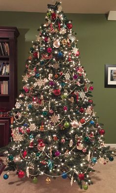 a decorated christmas tree in a living room