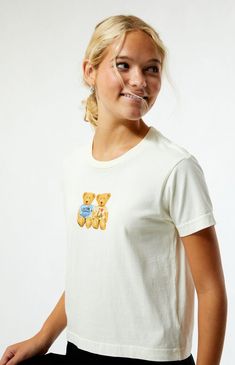 The Teddy Bear T-Shirt from PS / LA brings a cute, playful vibe to your look. It has short sleeves, a crew neckline, and a teddy bear graphic on the front. The slightly cropped length and relaxed boxy fit make it perfect for a laid-back, casual style.Solid color teeShort sleevesCrew necklineFront graphicRelaxed boxy fitSlightly cropped length100% cottonMachine washableModel is wearing a size smallModel measurements: 5’7.5” height, 32” bust, 24” waist, 35” hips PS / LA Womens Teddy Bear T-Shirt - White size XS White Short Sleeve T-shirt With Bear Print, Trendy Crew Neck T-shirt With Bear Print, Casual Bear Design Crew Neck Top, Graphic Tee With Bear Print And Crew Neck, Casual Crew Neck Top With Bear Print, Casual Cotton T-shirt With Bear Design, Playful Short Sleeve Tops For Everyday, Cotton Tops With Bear Print And Relaxed Fit, Cute Bear Print Crew Neck T-shirt