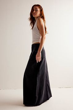 Forever cool and classic denim maxi from our We The Free collection. **Fit:** Mid-rise, A-line silhouette and rigid denim **Features:** Zip fly and button closure, four-pocket design, inverted yoke seam at front, raw-edge hem **Why We | We The Free Come As You Are Denim Maxi Skirt at Free People in Black, Size: US 0 Black Denim Maxi Skirt, Maxi Skirt Style, Free People Maxi, Long Denim Skirt, Black Denim Skirt, Denim Maxi, Free People Skirt, Denim Maxi Skirt, Madewell Denim