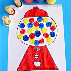 an art project for kids to make with wine corks and gumball stamps on paper