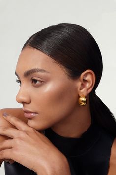 These gold chunky hoop earrings add a touch of chic to any look. Perfectly minimalistic, waterproof, and tarnish-free, these beauties make a great go-to statement earrings. Made of hollow + lightweight metal and dipped in thick gold plating, these earrings are perfect for everyday wear! ………………………………….D E T A I L S• Materials: Stainless steel, 18k gold plating• Hoop Diameter: 2.3cm (0.8 inches) • Hoop Width: 1.8cm (0.7 inch)• This product is hypoallergenic, waterproof and tarnish resistant Contemporary Fine Jewelry, Chunky Hoop Earrings, Modern Muse, Minimal Jewelry, Jewelry Photography, Jewelry Branding, Gold Plating, Jewelry Care, Statement Earrings