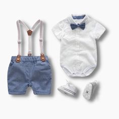 Dress your little boy in style and comfort with our Baby Boy Tie and Suspenders set! This adorable outfit is the perfect choice for your little ones, combining fashion and convenience for a charming look. The set features a short-sleeve shirt with a classic bowtie and matching suspenders shorts, creating a cool and fashionable ensemble. The turn-down collar design adds a touch of sophistication, making your baby boy look dapper and stylish. Crafted with care, the shirt comes with 3 snaps at the Light Blue Cotton Sets For Summer, Fitted Short Sleeve Sets For Playtime, Light Blue Short Sleeve Sets For Summer, Light Blue Short Sleeve Summer Sets, Classic Cotton Set For Spring, Classic Cotton Sets For Summer, Classic Short Sleeve Sets For Spring, Classic Cotton Summer Sets, Light Blue Short Sleeve Sets For Spring