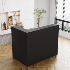 a black reception table in front of a window