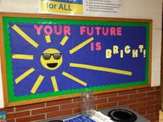 a sign that says your future is bright on the side of a brick wall next to a stove