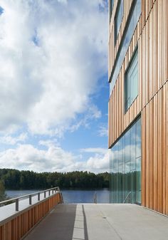 a wooden building next to a body of water