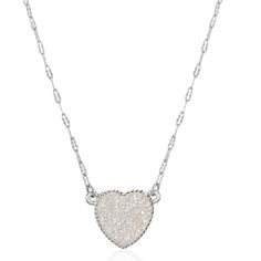 PRICES MAY VARY. STYLISH DESIGN - This delicate sparkling heart necklace features an elegant, iridescent crystal pendant that you'll never want to take off. It's perfect from day to night and will be a trendy and pretty addition to your jewelry collection. SUPERIOR QUALITY - Every detail has been fine-tuned for maximum quality, longevity, and comfort. Approx. Measurements: 16 inches with a 3 inch extender and a 15mm pendant. Silver tone plated, with glittery simulated geode textured stones that White Heart Pendant Necklace For Party, White Heart Necklace For Valentine's Day Party, Valentine's Day White Heart Necklace For Party, White Heart Necklace For Party, White Charm Necklace With Delicate Chain For Valentine's Day, White Heart Necklace For Valentine's Day, White Heart-cut Necklace For Valentine's Day, White Heart Cut Necklace For Valentine's Day, White Clavicle Chain Heart Necklace For Anniversary