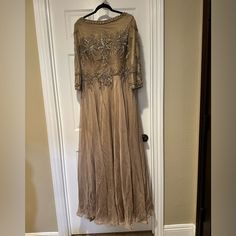 a dress hanging up on a door