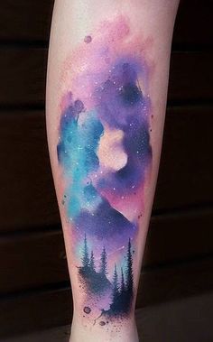 a person's leg with a watercolor painting on it