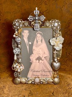 an ornate frame holds a photograph of a bride and groom