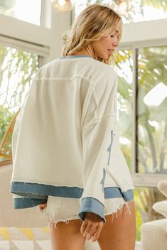 Expertly crafted for ultimate comfort, our Star Patch French Terry Top is as soft as a cloud. The crisp white fabric is adorned with denim blue star accents, adding a touch of playful charm. Complete with a trendy raw hemline and side slits, this top is the perfect transitional piece for your fall wardrobe. Details: Long sleeves Drop Shoulder Ribbed cuff Side slits Round neckline Fits TTS Self: 74% Cotton | 78% Polyester Contrast: 75% Cotton | 18% Polyester | 2% Spandex Imported Model Info: Meas Trendy Washed White Tops, Trendy White Washed Tops, White Relaxed Fit Bleached Tops, White Bleached Relaxed Fit Tops, Relaxed Fit White Bleached Tops, White Denim Tops For Fall, White Denim Casual Tops, Trendy White Denim Tops, White Cotton Tops With Contrast Stitching