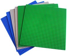 three green and blue lego coasters sitting on top of each other