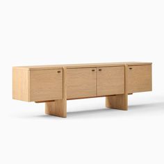 the sideboard is made from wood and has three drawers, one with two doors