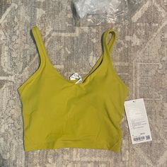 New With Tags Align Tank From Lululemon Size 6. Light Support For An A/B Cup Muted Lemon/Green Color Yellow Summer Sports Bra For Gym, Fitted Yellow Sports Bra For Light Exercise, Casual Green Tops With Light Support, Yellow Stretch Sports Bra, Casual Style, Yellow Seamless Activewear For Yoga, Yellow Seamless Yoga Activewear, Yellow Athleisure Tops For Gym, Yellow Athleisure Tops For The Gym, Yellow Athleisure Tops For Yoga