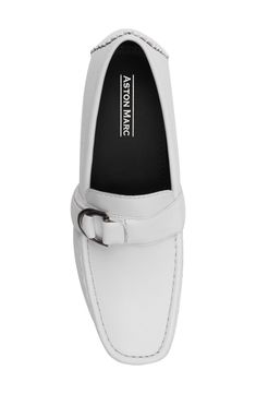 A silver-tone buckle details the vamp of this loafer crafted from textured faux leather. Moc toe Slip-on style Synthetic upper/rubber sole Imported Classic Slip-on Loafers With Metal Pin Buckle, Formal Flat Loafers With Buckle Closure, Modern Loafers With Buckle Closure, Business Loafers With Buckle Closure And Slip-on Design, Workwear Buckle Closure Slip-on Loafers, Formal Loafers With Buckle Closure, Casual Office Loafers With Buckle Closure, Flat Loafers With Buckle Closure For Office, Classic Almond Toe Loafers With Buckle Closure