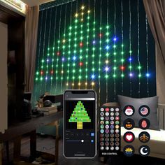 a christmas tree is displayed on the wall next to a remote control and other decorations