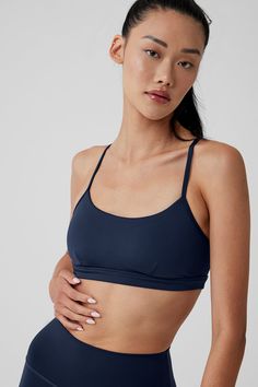 Here’s why the Intrigue Bra will be your new go-to: It’s made from our signature Airlift fabric for a supportive, snug fit that’s ready for everything from HIIT to headstands. The cut is simple but flattering, designed with a scoop-neck, adjustable straps that crisscross in back for extra lift, and a keyhole cutout. Wear it with sweats to cozy up at home, with matching Airlift leggings to make a cute set… Really, when won’t you reach for it? Fitted Activewear With Built-in Bra In Recycled Polyester, Alo Yoga Activewear With Built-in Bra For Yoga, Alo Yoga Fitted Sports Bra With Light Support, Supportive Padded Functional Activewear, Padded Fitted Yoga Activewear, High Stretch Padded Sports Bra For Workout, Padded Fitted Activewear For Yoga, Fitted Activewear With Bra-friendly Design In Recycled Polyester, Compressive Bra-friendly Alo Yoga Activewear