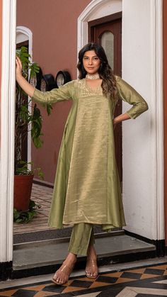 Green Golden Tissue Chanderi Anarkali Kurta Set, Kurta pant set Anarkali dresses, Indian wedding outfit Bring on the festive spirit with our anarkali kurta set in pure tissue and chanderi silk. Panelled Anarkali Kurta with separate inner and matching cotton silk pants. Kurta Fabric : Pure Tissue + Chanderi Silk. Pants : Cotton Silk. Dupatta : Pure Tissue. Colour : Light Green. Model height is 5.6" and is wearing a size S. Wash Care : Dry Clean Only. This product will be exclusively handcrafted f Eid Tussar Silk Palazzo Set With Sheer Dupatta, Festive Tussar Silk Palazzo Set With Straight Kurta, Tussar Silk Palazzo Set With Sheer Dupatta, Tussar Silk Sets With Sheer Dupatta For Eid, Festive Unstitched Tussar Silk Palazzo Set, Festive Slub Silk Kurta With Dabka, Festive Slub Silk Kurta With Dabka Details, Designer Tussar Silk Salwar Kameez With Straight Kurta, Tussar Silk Palazzo Set For Eid