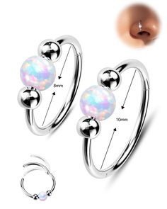 an image of two opal balls on the back of a pair of nose rings