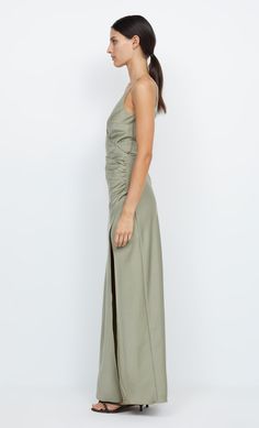 The Eternity V Maxi Dress is a wrap style cut on the bias in a flattering silhouette. The maxi dress features a v-neck and back, ruching at the cinched waist and straight maxi skirt with leg split. Floor-length Maxi Dress With Ruched Back For Date Night, Fitted V-neck Midi Dress With Ruched Sides, Pre-draped Maxi Dress With Side Slits, Spring Date Night Maxi Dress With Ruched Back, Spring Maxi Dress For Date Night With Ruched Back, Backless Maxi Dress With Ruched Back For Gala, Spring Pre-draped V-neck Maxi Dress, Elegant Maxi Dress With Ruched Back For Date Night, Fitted Maxi Dress With Side Slits And Pre-draped Style